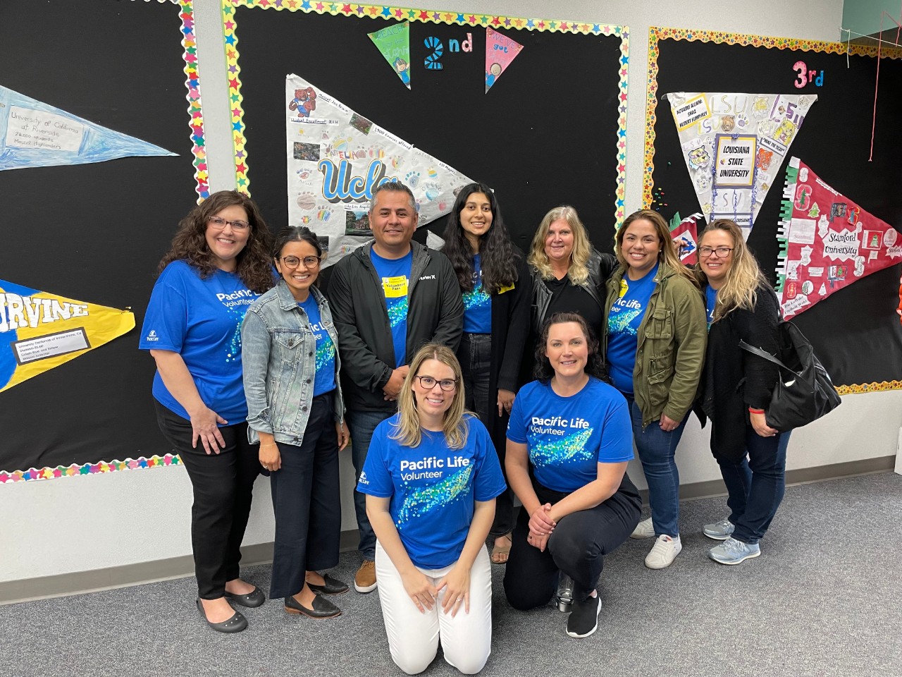 A group of employees volunteering at a school.